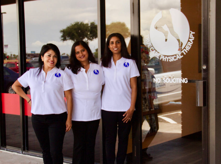 Angie, Pallavi, and Bhakti standing outside of True Care Physical Therapy